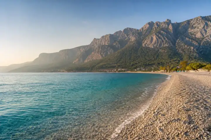 Konyaaltı Beach and the Taurus Mountains beside the turquoise Mediterranean in Antalya.