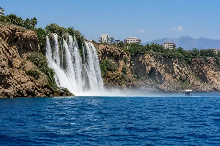 Lower Düden Waterfall plunging from the Antalya cliffs into the Mediterranean Sea.