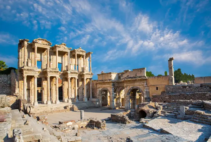 Morning light warms the Library of Celsus and the triple gate beside it at Ephesus, the marble forecourt almost empty.