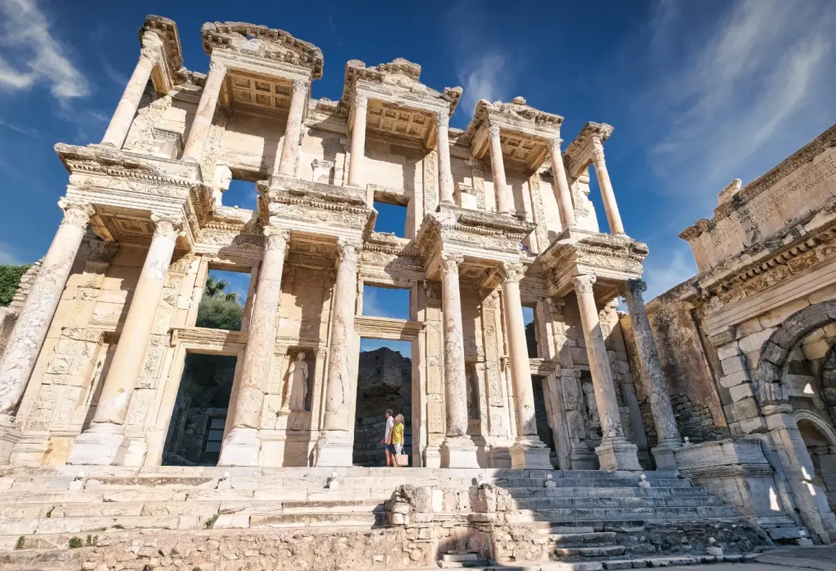 A low wide-angle view exaggerates the height of the two-storey Corinthian facade of the Library of Celsus at Ephesus.