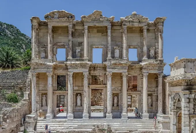 A straight front view of the Library of Celsus at Ephesus shows all four virtue statues standing in their lower niches.
