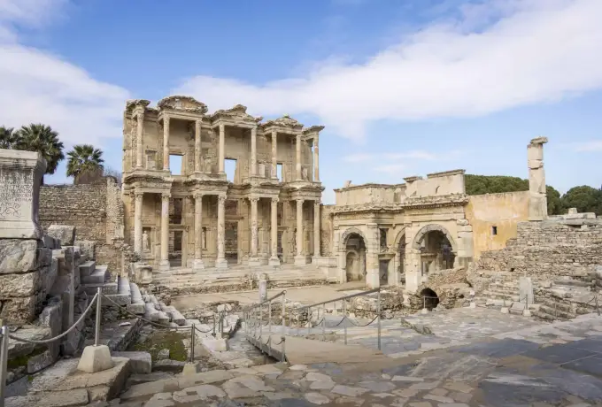 The Library of Celsus and its neighbouring gate stand in crisp winter light at Ephesus with the forecourt almost empty.