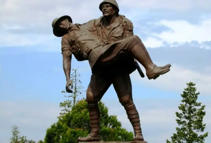 A bronze statue on the Gallipoli peninsula shows a Turkish soldier carrying a wounded enemy soldier in his arms.