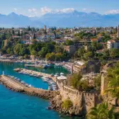 Kaleici old harbor and red-roofed Antalya beneath the Taurus Mountains