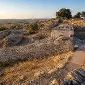 Bronze Age citadel walls and layered ruins at the archaeological site of Troy