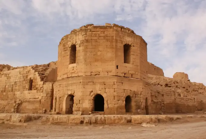 Historic stone tower and weathered ruins of Harran Castle near Sanliurfa in southeastern Turkey.